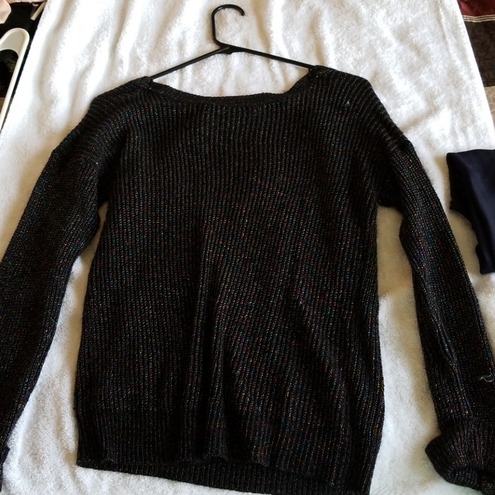 Black  sparkling  sweater in a large